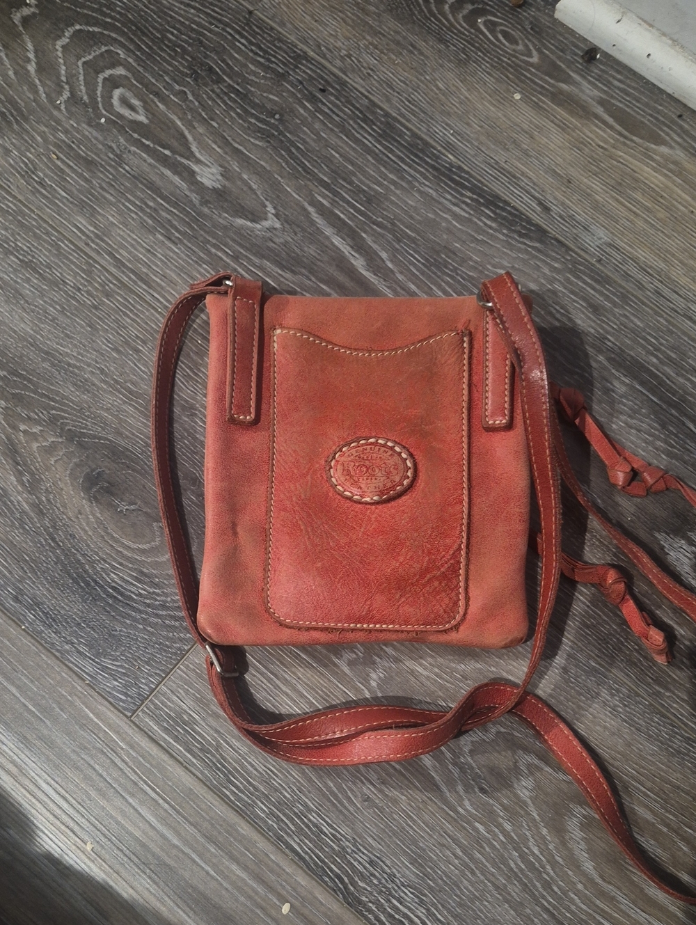 Roots Small Crossbody Bag in Rust Red Leather